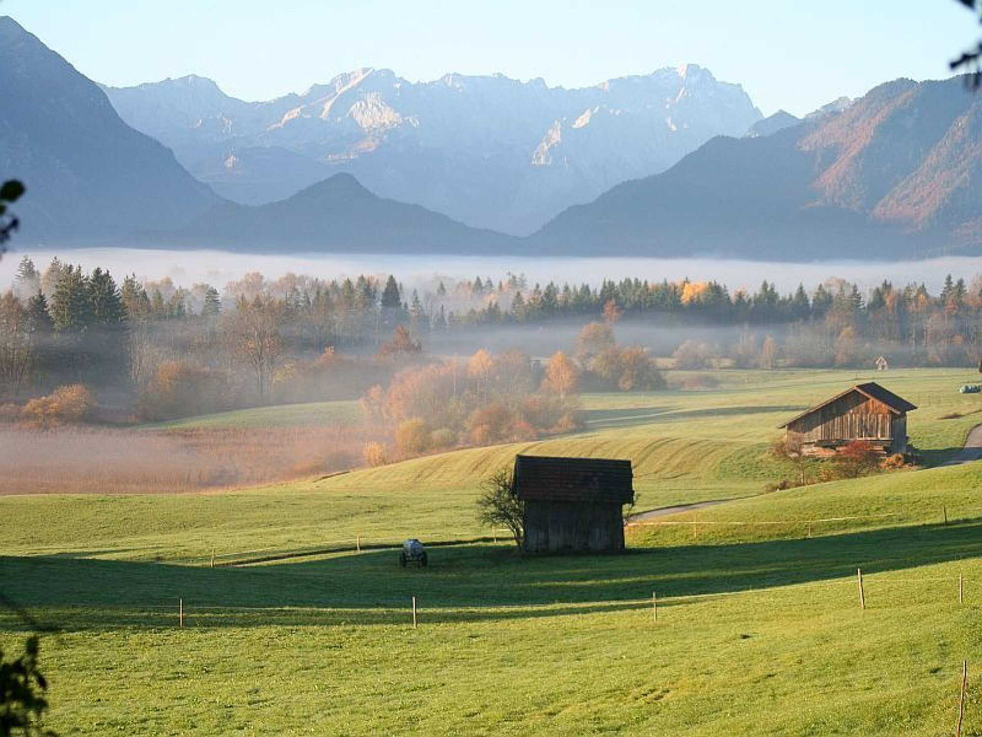 view over the moor Murnauer Moos in direction Mt. Zugspitze and Mt. Alpsitze